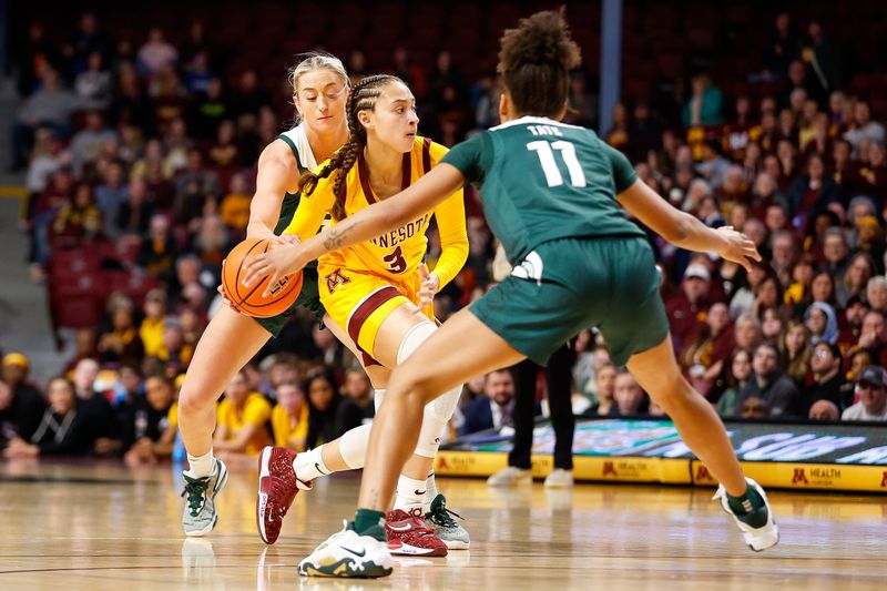 Jan 20, 2024; Minneapolis, Minnesota, USA; Minnesota Golden Gophers guard Amaya Battle (3) works up court as Michigan State Spartans guards Tory Ozment (1) and Jocelyn Tate (11) defend during the first half at Williams Arena. Mandatory Credit: Matt Krohn-USA TODAY Sports