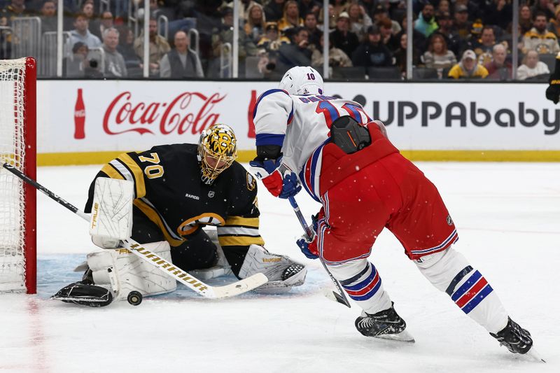 Nov 28, 2025; Boston, Massachusetts, USA; Boston Bruins goaltender Joonas Korpisalo (70) makes a save as New York Rangers left wing Artemi Panarin (10) looks for the rebound during the second period at TD Garden. Mandatory Credit: Winslow Townson-Imagn Images
