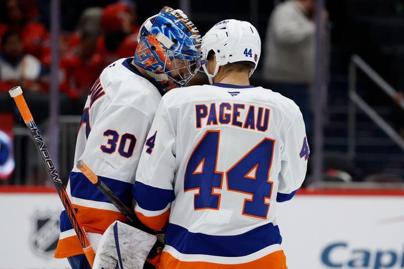 Oct 31, 2025; Washington, District of Columbia, USA; New York Islanders goaltender Ilya Sorokin (30) celebrates with Islanders center Jean-Gabriel Pageau (44) after their game against the Washington Capitals at Capital One Arena. Mandatory Credit: Geoff Burke-Imagn Images