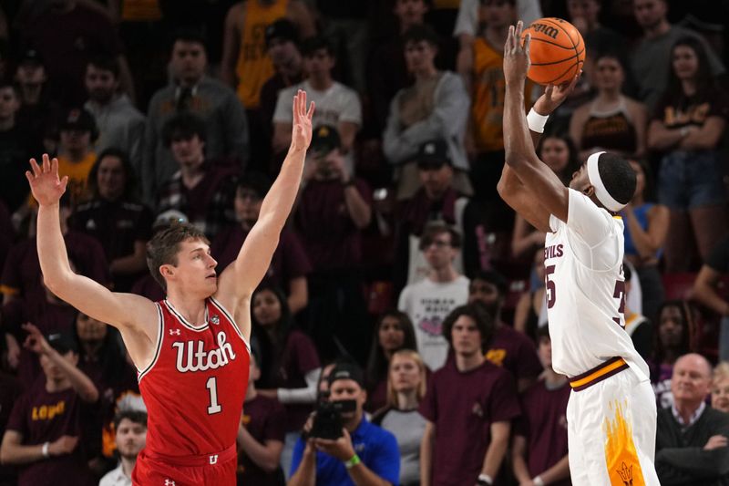 Feb 18, 2023; Tempe, Arizona, USA; Arizona State Sun Devils guard Devan Cambridge (35) shoots over Utah Utes forward Ben Carlson (1) during the first half at Desert Financial Arena. Mandatory Credit: Joe Camporeale-USA TODAY Sports