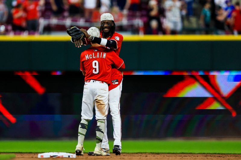May 17, 2025; Cincinnati, Ohio, USA; Cincinnati Reds second baseman Matt McLain (9) hugs shortstop Elly De La Cruz (44) react after the victory over the Cleveland Guardians at Great American Ball Park. Mandatory Credit: Katie Stratman-Imagn Images