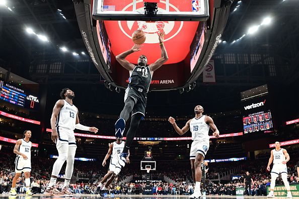 ATLANTA, GA - DECEMBER 23: Clint Capela #15 of the Atlanta Hawks dunks the ball during the game against the Memphis Grizzlies on December 23, 2023 at State Farm Arena in Atlanta, Georgia.  NOTE TO USER: User expressly acknowledges and agrees that, by downloading and/or using this Photograph, user is consenting to the terms and conditions of the Getty Images License Agreement. Mandatory Copyright Notice: Copyright 2023 NBAE (Photo by Adam Hagy/NBAE via Getty Images)