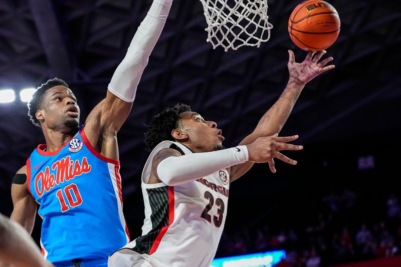 Feb 7, 2023; Athens, Georgia, USA; Georgia Bulldogs center Braelen Bridges (23) tries to score behind Mississippi Rebels forward Theo Akwuba (10) during the second half at Stegeman Coliseum. Mandatory Credit: Dale Zanine-USA TODAY Sports