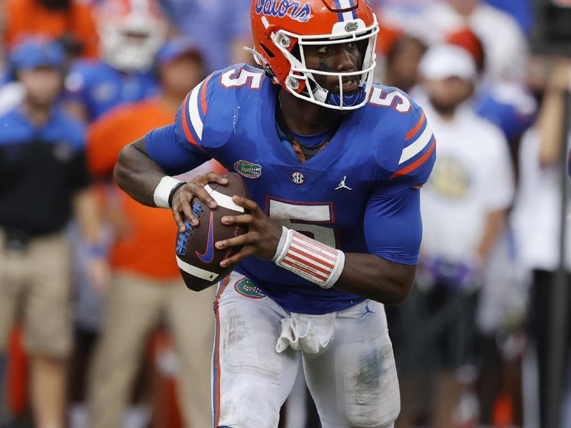 Sep 18, 2021; Gainesville, Florida, USA; Florida Gators quarterback Emory Jones (5) drops back against the Alabama Crimson Tide during the second half at Ben Hill Griffin Stadium. Mandatory Credit: Kim Klement-USA TODAY Sports