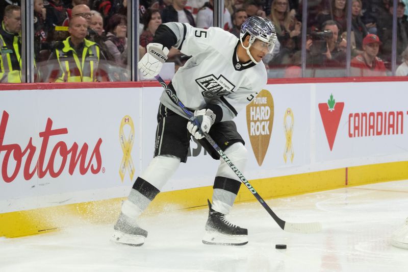 Nov 2, 2023; Ottawa, Ontario, CAN; Los Angeles Kings right wing Quinton Byfeld (55) skates with the puck in the second period against the Ottawa Senators at the Canadian Tire Centre. Mandatory Credit: Marc DesRosiers-USA TODAY Sports