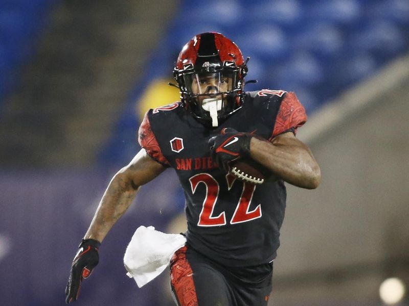 Dec 21, 2021; Frisco, TX, USA; San Diego State Aztecs running back Greg Bell (22) runs the ball against UTSA Roadrunners in the third quarter during the 2021 Frisco Bowl at Toyota Stadium. Mandatory Credit: Tim Heitman-USA TODAY Sports