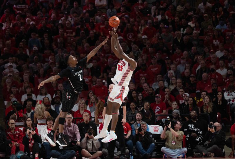 Jan 28, 2023; Houston, Texas, USA; Houston Cougars forward Jarace Walker (25) shoots against Cincinnati Bearcats guard Landers Nolley II (2) in the second half at Fertitta Center. Houston Cougars won 75 to 69 .Mandatory Credit: Thomas Shea-USA TODAY Sports