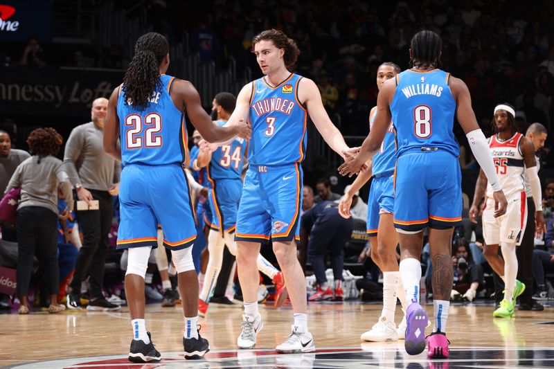 WASHINGTON, DC -? JANUARY 8: Josh Giddey #3 high fives Cason Wallace #22 and Jalen Williams #8 of the Oklahoma City Thunder during the game against the Washington Wizards on January 8, 2024 at Capital One Arena in Washington, DC. NOTE TO USER: User expressly acknowledges and agrees that, by downloading and or using this Photograph, user is consenting to the terms and conditions of the Getty Images License Agreement. Mandatory Copyright Notice: Copyright 2024 NBAE (Photo by Stephen Gosling/NBAE via Getty Images)