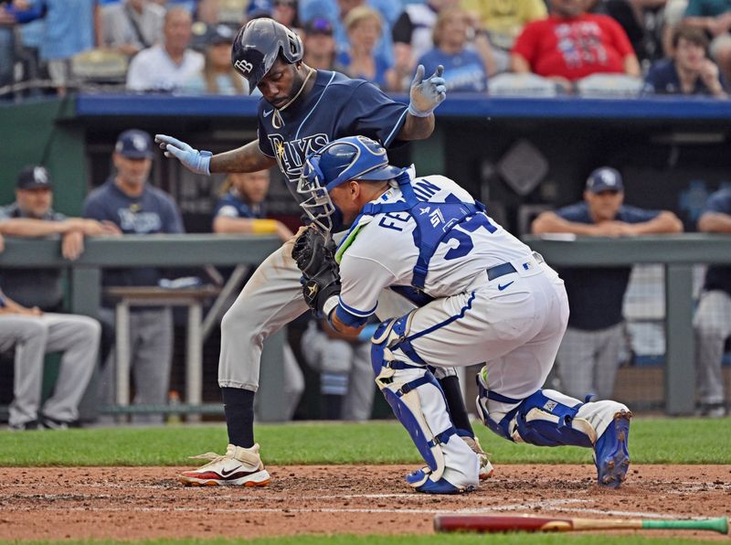 Jul 15, 2023; Kansas City, Missouri, USA;  Kansas City Royals catcher Freddy Fermin (34) tags out Tampa Bay Rays left fielder Randy Arozarena (56) at home plate in the sixth inning at Kauffman Stadium. Mandatory Credit: Peter Aiken-USA TODAY Sports