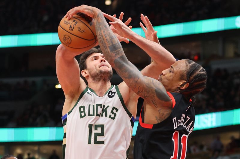 CHICAGO, ILLINOIS - MARCH 01: DeMar DeRozan #11 of the Chicago Bulls blocks a shot by Danilo Gallinari #12 of the Milwaukee Bucks during the first half at the United Center on March 01, 2024 in Chicago, Illinois. NOTE TO USER: User expressly acknowledges and agrees that, by downloading and or using this photograph, User is consenting to the terms and conditions of the Getty Images License Agreement. (Photo by Michael Reaves/Getty Images)