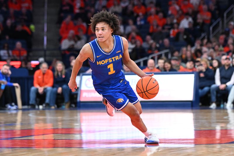 Dec 13, 2025; Syracuse, New York, USA; Hofstra Pride guard Preston Edmead (1) dribbles against the Syracuse Orange in the first half at the JMA Wireless Dome. Mandatory Credit: Mark Konezny-Imagn Images