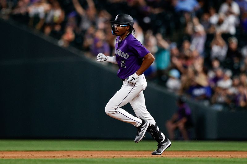 Jun 17, 2024; Denver, Colorado, USA; Colorado Rockies pinch hitter Greg Jones (2) rounds the bases on a solo home run in the ninth inning against the Los Angeles Dodgers at Coors Field. Mandatory Credit: Isaiah J. Downing-USA TODAY Sports