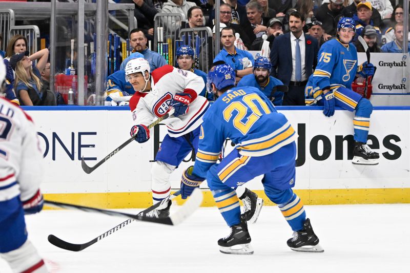 Nov 4, 2023; St. Louis, Missouri, USA; Montreal Canadiens defenseman Johnathan Kovacevic (26) takes a shot against the St. Louis Blues during the third period at Enterprise Center. Mandatory Credit: Jeff Le-USA TODAY Sports