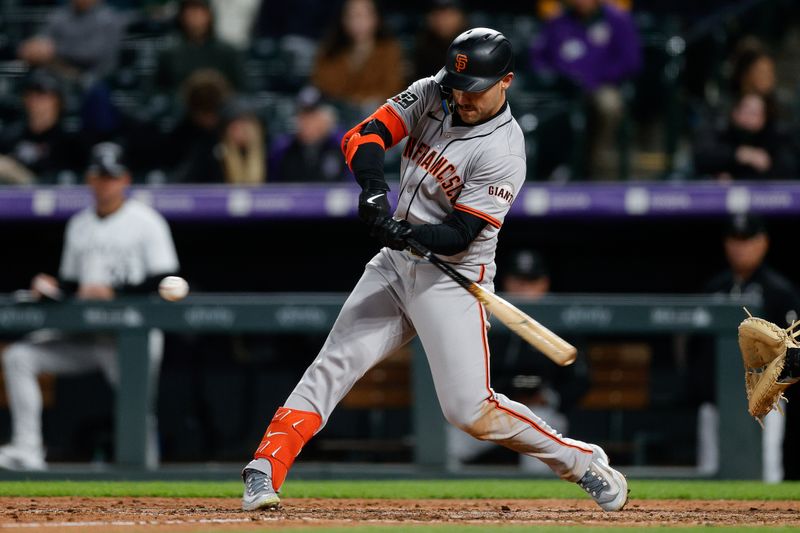 May 7, 2024; Denver, Colorado, USA; San Francisco Giants left fielder Michael Conforto (8) hits an RBI single in the seventh inning against the Colorado Rockies at Coors Field. Mandatory Credit: Isaiah J. Downing-USA TODAY Sports