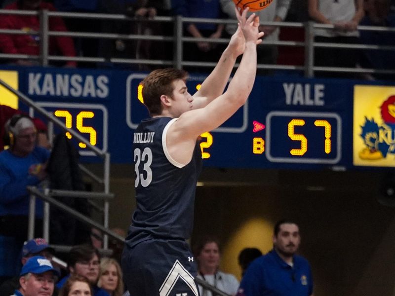 Dec 22, 2023; Lawrence, Kansas, USA; Yale Bulldogs forward Jack Molloy (33) scores a three point shot against the Kansas Jayhawks during the second half at Allen Fieldhouse. Mandatory Credit: Denny Medley-USA TODAY Sports