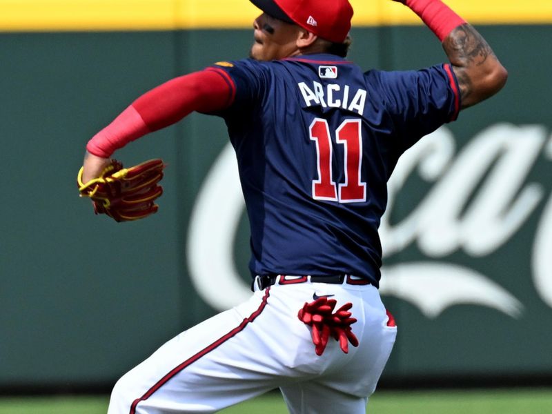 Mar 5, 2024; North Port, Florida, USA; Atlanta Braves shortstop Orlando Arcia (11) throws to home plate in the third inning of the spring training game against the Detroit Tigers at CoolToday Park. Mandatory Credit: Jonathan Dyer-USA TODAY Sports