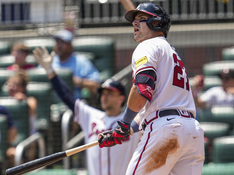 Jul 20, 2023; Cumberland, Georgia, USA; Atlanta Braves third baseman Austin Riley (27) reacts after hitting a home run against the Arizona Diamondbacks during the eighth inning at Truist Park. Mandatory Credit: Dale Zanine-USA TODAY Sports