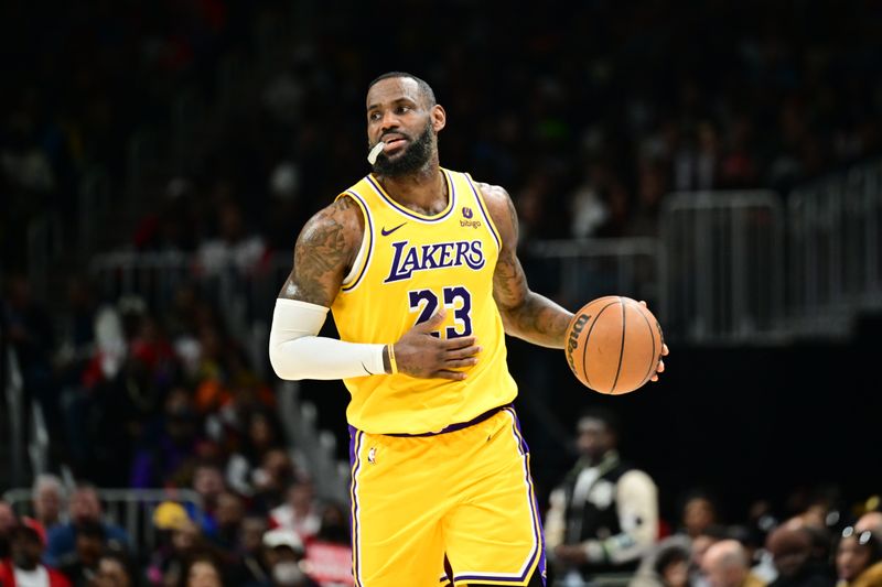 ATLANTA, GA - JANUARY 30: LeBron James #23 of the Los Angeles Lakers handles the ball during the game  against the Atlanta Hawks on January 30, 2024 at State Farm Arena in Atlanta, Georgia.  NOTE TO USER: User expressly acknowledges and agrees that, by downloading and/or using this Photograph, user is consenting to the terms and conditions of the Getty Images License Agreement. Mandatory Copyright Notice: Copyright 2024 NBAE (Photo by Adam Hagy/NBAE via Getty Images)