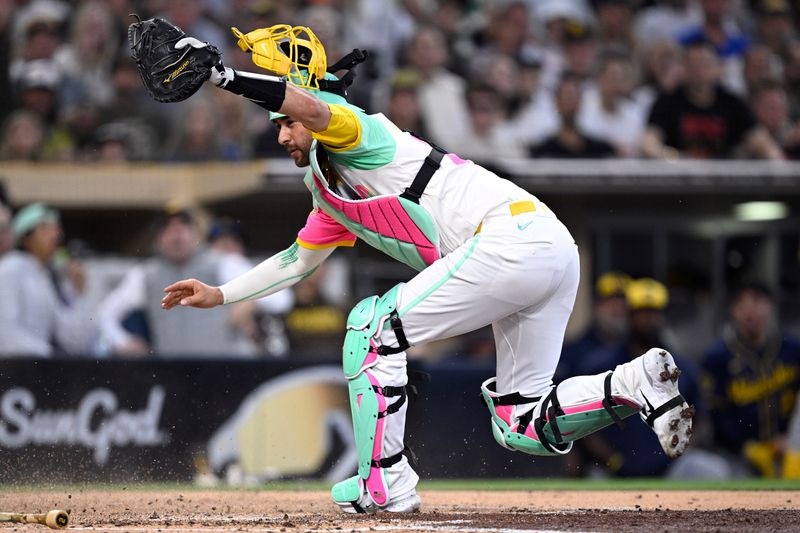 Jun 21, 2024; San Diego, California, USA; San Diego Padres catcher Kyle Higashioka (20) cannot tag out Milwaukee Brewers designated hitter Tyler Black (not pictured) during the fifth inning at Petco Park. Mandatory Credit: Orlando Ramirez-USA TODAY Sports