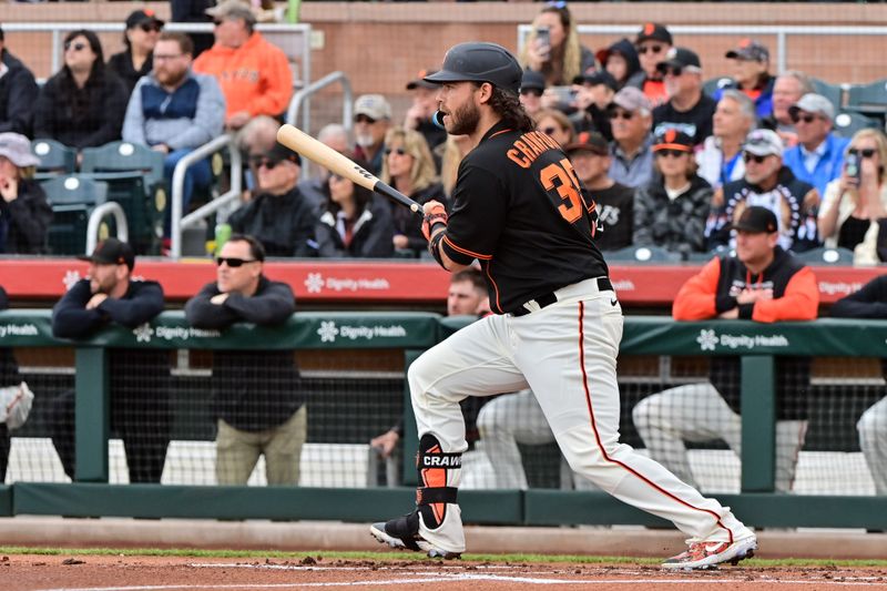 Mar 22, 2023; Scottsdale, Arizona, USA; San Francisco Giants shortstop Brandon Crawford (35) singles in the first inning against the Texas Rangers during a Spring Training game at Scottsdale Stadium. Mandatory Credit: Matt Kartozian-USA TODAY Sports