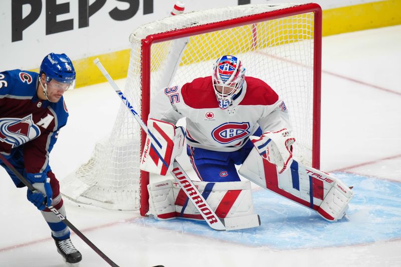 Mar 26, 2024; Denver, Colorado, USA; Montreal Canadiens goaltender Sam Montembeault (35) defends the net from Colorado Avalanche right wing Mikko Rantanen (96) in the first period at Ball Arena. Mandatory Credit: Ron Chenoy-USA TODAY Sports