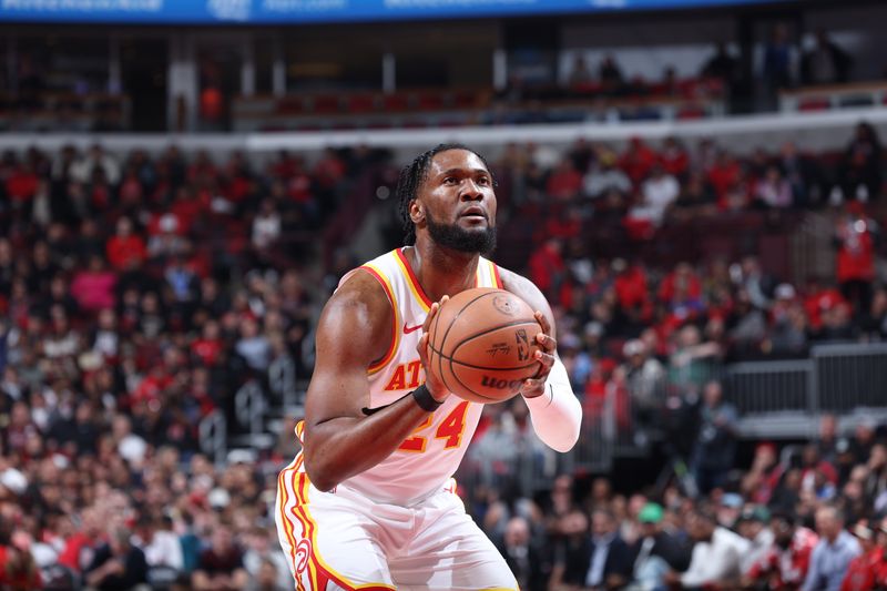 CHICAGO, IL - APRIL 17:  Bruno Fernando #24 of the Atlanta Hawks shoots a free throw during the game  against the Chicago Bulls during the 2024 Play-In Tournament  on April 17, 2024 at United Center in Chicago, Illinois. NOTE TO USER: User expressly acknowledges and agrees that, by downloading and or using this photograph, User is consenting to the terms and conditions of the Getty Images License Agreement. Mandatory Copyright Notice: Copyright 2024 NBAE (Photo by Jeff Haynes/NBAE via Getty Images)