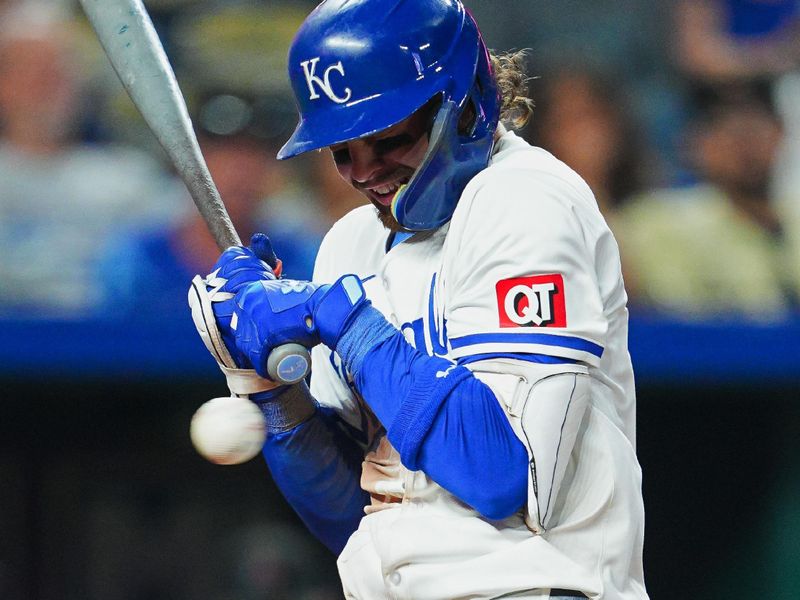 Jul 22, 2024; Kansas City, Missouri, USA; Kansas City Royals shortstop Bobby Witt Jr. (7) is hit by a pitch during the sixth inning against the Arizona Diamondbacks at Kauffman Stadium. Mandatory Credit: Jay Biggerstaff-USA TODAY Sports