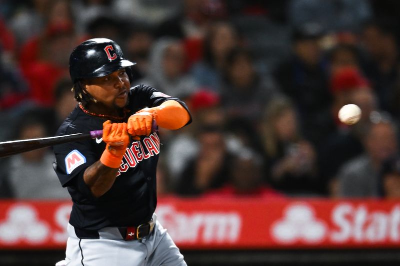 May 25, 2024; Anaheim, California, USA; Cleveland Guardians third baseman José Ramírez (11) singles against the Los Angeles Angels during the eighth inning at Angel Stadium. Mandatory Credit: Jonathan Hui-USA TODAY Sports