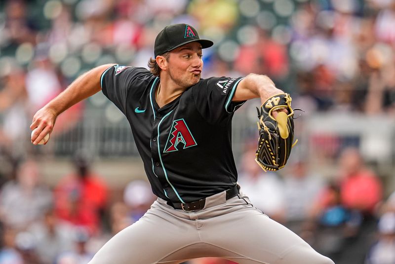 Jun 5, 2025; Cumberland, Georgia, USA; Arizona Diamondbacks starting pitcher Brandon Pfaadt (32) pitches against the Atlanta Braves during the first inning at Truist Park. Mandatory Credit: Dale Zanine-Imagn Images