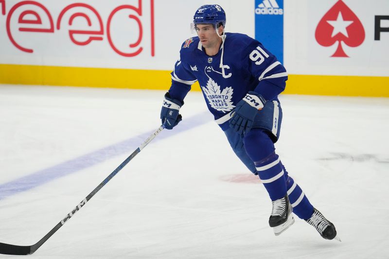 Nov 6, 2023; Toronto, Ontario, CAN; Toronto Maple Leafs forward John Tavares (91) skates during warm up before a game against the Tampa Bay Lightning at Scotiabank Arena. Mandatory Credit: John E. Sokolowski-USA TODAY Sports