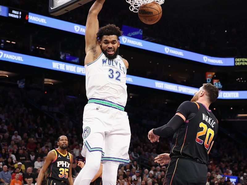 PHOENIX, ARIZONA - NOVEMBER 15: Karl-Anthony Towns #32 of the Minnesota Timberwolves slam dunks against the Phoenix Suns during the first half of the NBA game at Footprint Center on November 15, 2023 in Phoenix, Arizona. NOTE TO USER: User expressly acknowledges and agrees that, by downloading and or using this photograph, User is consenting to the terms and conditions of the Getty Images License Agreement.  (Photo by Christian Petersen/Getty Images)