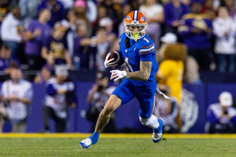 Nov 11, 2023; Baton Rouge, Louisiana, USA;  Florida Gators wide receiver Ricky Pearsall (1) catches a pass against the LSU Tigers during the first half at Tiger Stadium. Mandatory Credit: Stephen Lew-USA TODAY Sports