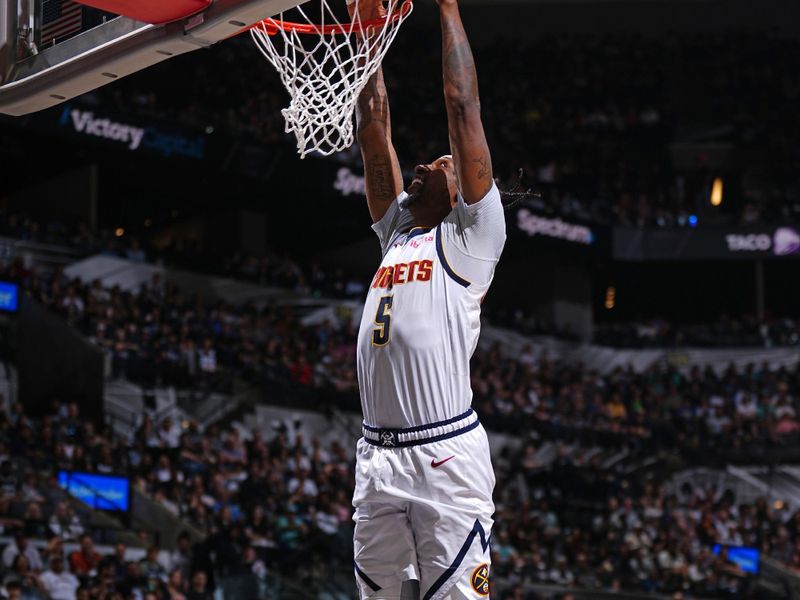 SAN ANTONIO, TX - APRIL 12: Kentavious Caldwell-Pope #5 of the Denver Nuggets dunks the ball during the game against the San Antonio Spurs on April 12, 2024 at the Frost Bank Center in San Antonio, Texas. NOTE TO USER: User expressly acknowledges and agrees that, by downloading and or using this photograph, user is consenting to the terms and conditions of the Getty Images License Agreement. Mandatory Copyright Notice: Copyright 2024 NBAE (Photos by Garrett Ellwood/NBAE via Getty Images)