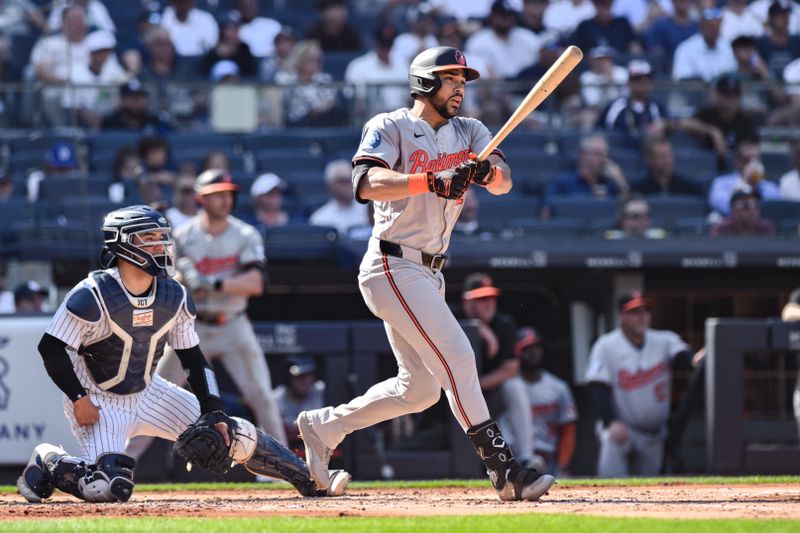 Jun 20, 2024; Bronx, New York, USA; Baltimore Orioles outfielder Anthony Santander (25) hits a single against the New York Yankees during the second inning at Yankee Stadium. Mandatory Credit: John Jones-USA TODAY Sports