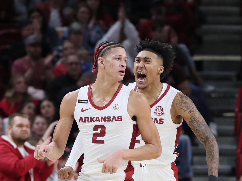 Dec 21, 2023; Fayetteville, Arkansas, USA; Arkansas Razorbacks guard Jeremiah Davenport (24) celebrates with forward Trevon Brazile (2) after a score by Brazile in the first half against the Abilene Christian Wildcats at Bud Walton Arena. Mandatory Credit: Nelson Chenault-USA TODAY Sports