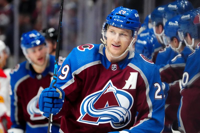 Dec 11, 2023; Denver, Colorado, USA; Colorado Avalanche center Nathan MacKinnon (29) celebrates his third period goal against the Calgary Flames at Ball Arena. Mandatory Credit: Ron Chenoy-USA TODAY Sports