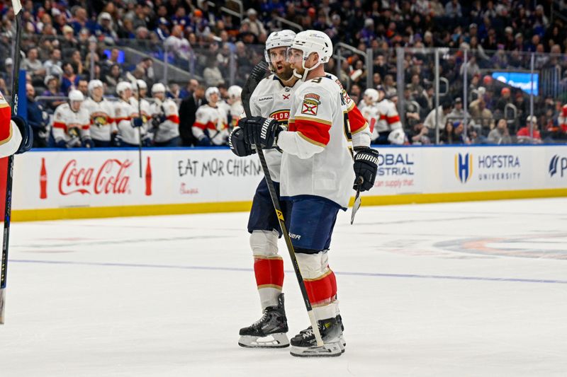 Mar 1, 2026; Elmont, New York, USA; Florida Panthers center Sam Bennett (9) celebrates his power play goal against the New York Islanders during the first period at UBS Arena. Mandatory Credit: Dennis Schneidler-Imagn Images