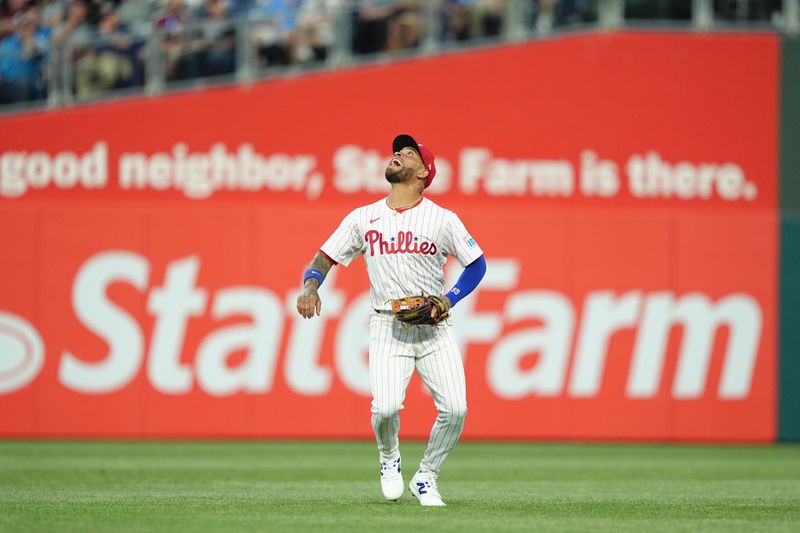 May 12, 2025; Philadelphia, Pennsylvania, USA; Philadelphia Phillies infielder Edmundo Sosa (33) fields a fly ball against the St. Louis Cardinals in the fifth inning at Citizens Bank Park. Mandatory Credit: Kyle Ross-Imagn Images