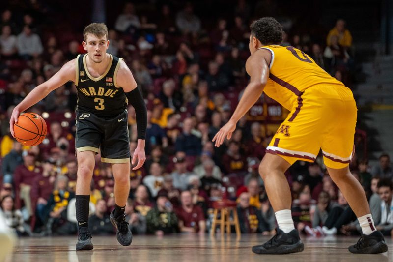 Jan 19, 2023; Minneapolis, Minnesota, USA; Purdue Boilermakers guard Braden Smith (3) is guarded by Minnesota Golden Gophers guard Taurus Samuels (0) in the second half at Williams Arena. Mandatory Credit: Matt Blewett-USA TODAY Sports