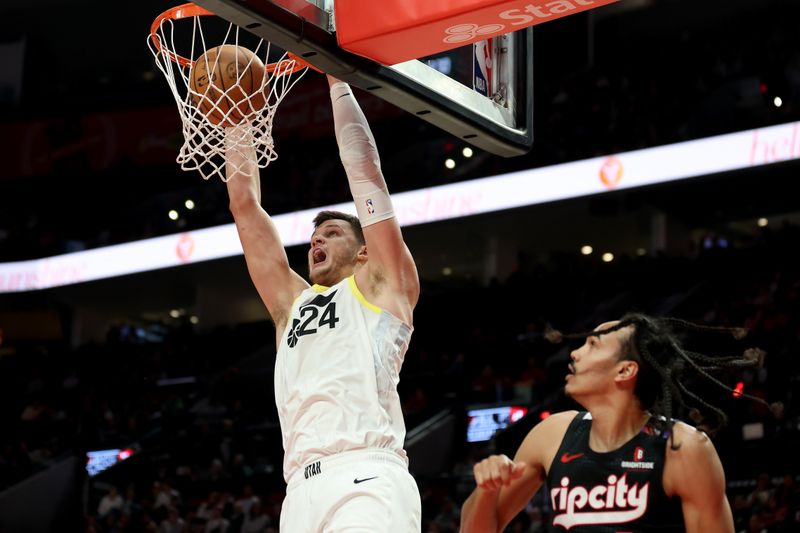 PORTLAND, OREGON - DECEMBER 06: Walker Kessler #24 of the Utah Jazz dunks against Dalano Banton #5 of the Portland Trail Blazers during the first half at Moda Center on December 06, 2024 in Portland, Oregon. NOTE TO USER: User expressly acknowledges and agrees that, by downloading and or using this photograph, User is consenting to the terms and conditions of the Getty Images License Agreement. (Photo by Steph Chambers/Getty Images)