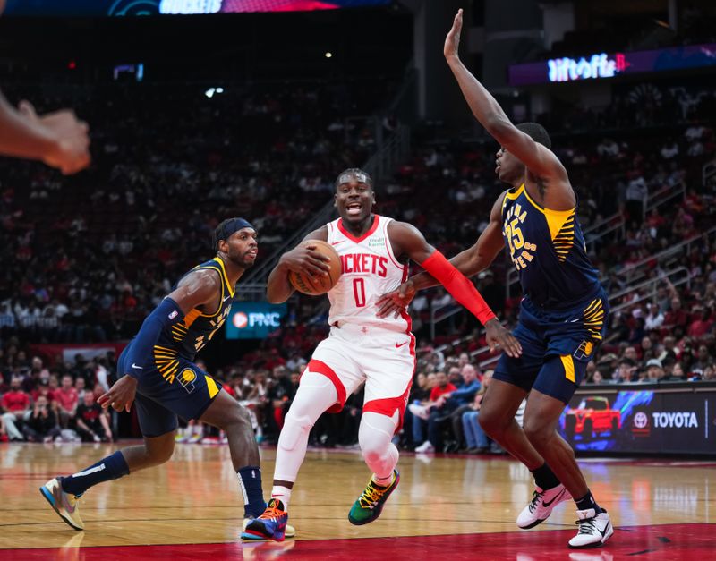 HOUSTON, TEXAS - OCTOBER 10: Aaron Holiday #0 of the Houston Rockets dribbles the ball during the preseason game against the Indiana Pacers at Toyota Center on October 10, 2023 in Houston, Texas. NOTE TO USER: User expressly acknowledges and agrees that, by downloading and or using this photograph, User is consenting to the terms and conditions of the Getty Images License Agreement. (Photo by Alex Bierens de Haan/Getty Images)