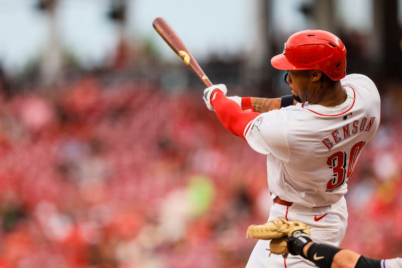 Jul 9, 2024; Cincinnati, Ohio, USA; Cincinnati Reds outfielder Will Benson (30) hits a three-run home run in the second inning against the Colorado Rockies at Great American Ball Park. Mandatory Credit: Katie Stratman-USA TODAY Sports