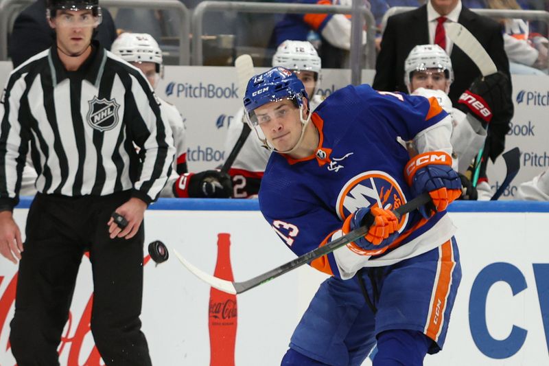 Mar 16, 2024; Elmont, New York, USA;  New York Islanders center Mathew Barzal (13) makes a pass against the Ottawa Senators during the second period at UBS Arena. Mandatory Credit: Thomas Salus-USA TODAY Sports