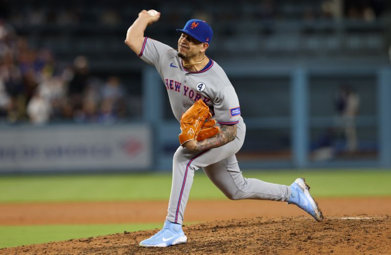 Jun 2, 2025; Los Angeles, California, USA; New York Mets pitcher Jose Butto (70) throws during the tenth inning against the Los Angeles Dodgers at Dodger Stadium. Mandatory Credit: Jason Parkhurst-Imagn Images