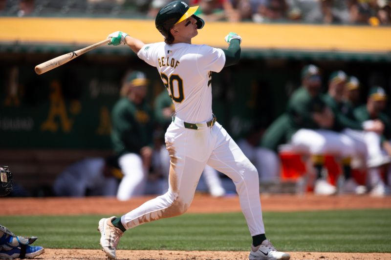 Jun 20, 2024; Oakland, California, USA; Oakland Athletics second baseman Zack Gelof (20) hits a two-run home run against the Kansas City Royals during the seventh inning at Oakland-Alameda County Coliseum. Mandatory Credit: D. Ross Cameron-USA TODAY Sports