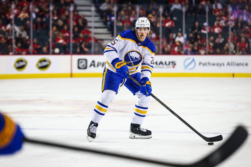 Jan 23, 2025; Calgary, Alberta, CAN; Buffalo Sabres defenseman Owen Power (25) controls the puck against the Calgary Flames during the first period at Scotiabank Saddledome. Mandatory Credit: Sergei Belski-Imagn Images