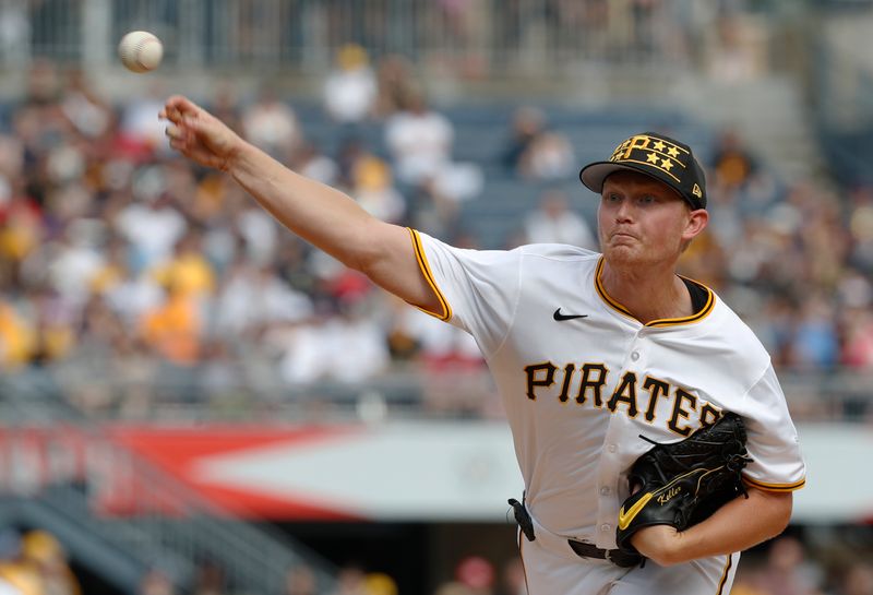 May 25, 2024; Pittsburgh, Pennsylvania, USA;  Pittsburgh Pirates starting pitcher Mitch Keller (23) delivers a pitch against the Atlanta Braves during the first inning at PNC Park. Mandatory Credit: Charles LeClaire-USA TODAY Sports