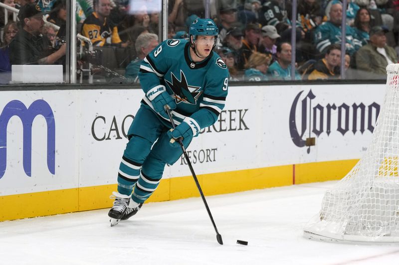 Nov 4, 2023; San Jose, California, USA; San Jose Sharks defenseman Jacob MacDonald (9) skates with the puck against the Pittsburgh Penguins during the third period at SAP Center at San Jose. Mandatory Credit: Darren Yamashita-USA TODAY Sports