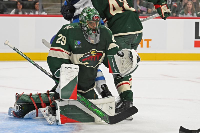 Sep 27, 2024; Saint Paul, Minnesota, USA;  Minnesota Wild goalie Marc-Andre Fleury (29) makes a save against the Winnipeg Jets during the first period at Xcel Energy Center. Mandatory Credit: Nick Wosika-Imagn Images

