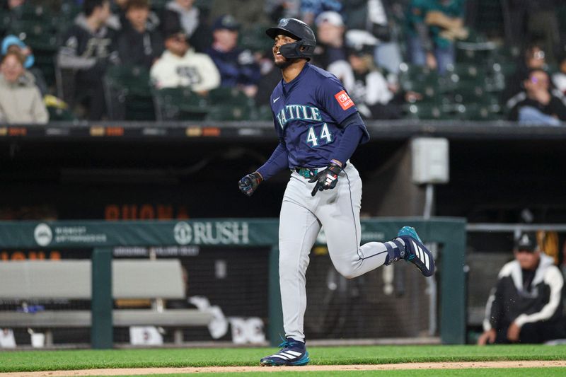 May 19, 2025; Chicago, Illinois, USA; Seattle Mariners center fielder Julio Rodríguez (44) rounds the bases after hitting a grand slam against the Chicago White Sox during the eight inning at Rate Field. Mandatory Credit: Kamil Krzaczynski-Imagn Images